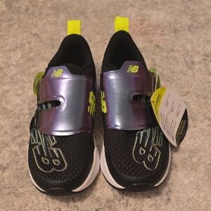 New Balance Kids Black Sneakers with Neon Yellow Accents and Iridescent Strap